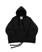 Black oversized hooded jacket for men and women with quilted lining and insulation.