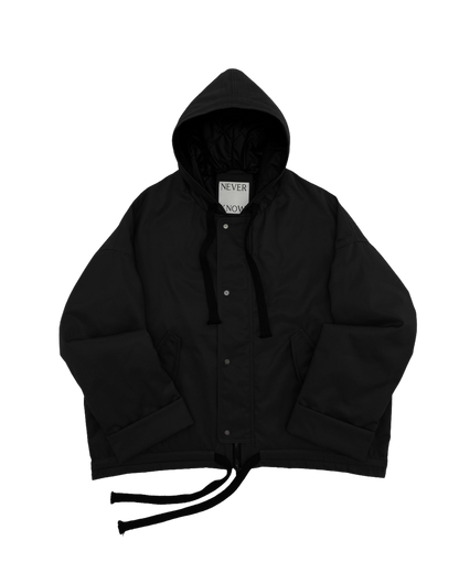 Black oversized hooded jacket for men and women with quilted lining and insulation.