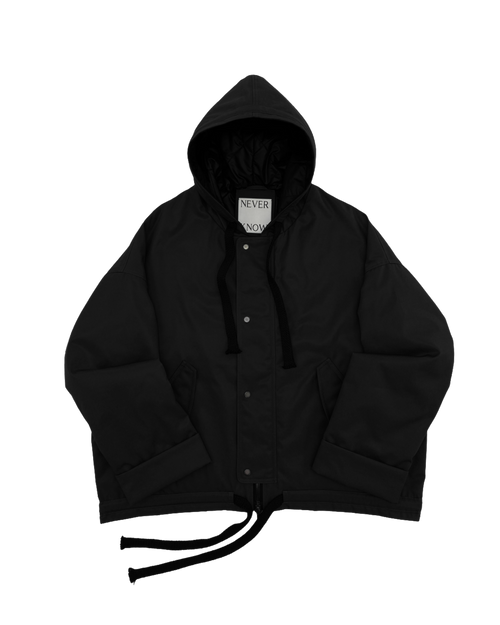 Black oversized hooded jacket for men and women with quilted lining and insulation.