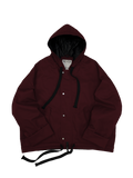 Wine red oversized hooded jacket with quilted lining and insulation.