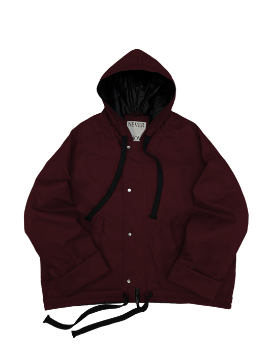 Wine red oversized hooded jacket with quilted lining and insulation.