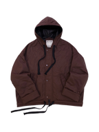 Brown oversized hooded jacket with quilted lining and insulation.