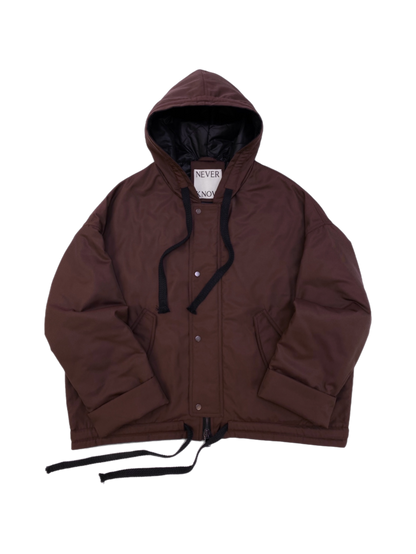 Brown oversized hooded jacket with quilted lining and insulation.