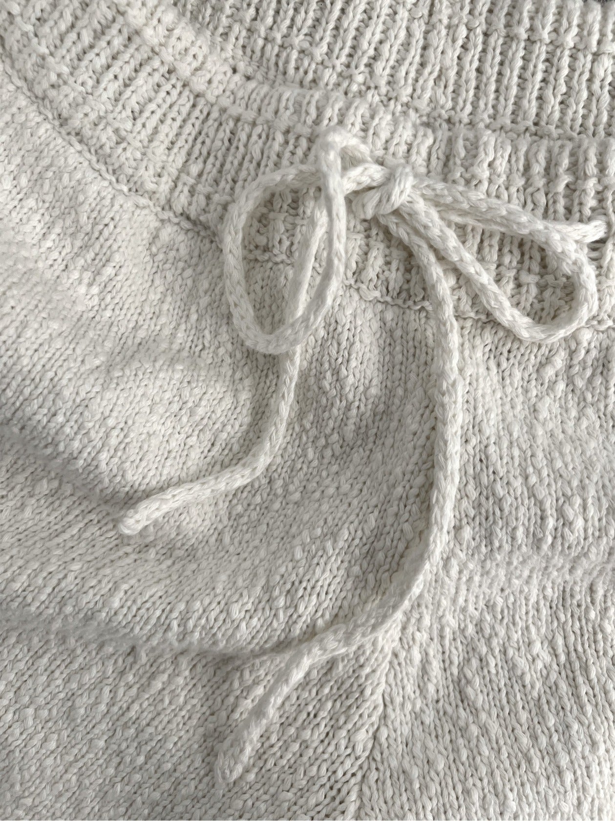 Texture of sustainable knitwear, white organic cotton