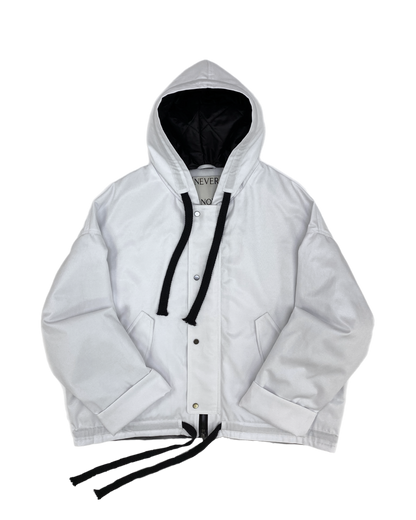 White oversized hooded jacket with quilted lining and insulation.